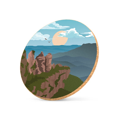 Illustrated cork coaster featuring Three Sisters artwork
